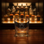 Legacy whiskey glass on bar shelf